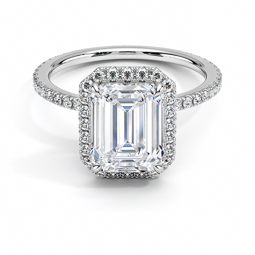 Anillo Constelación con diamante corte esmeralda, halo y pavé