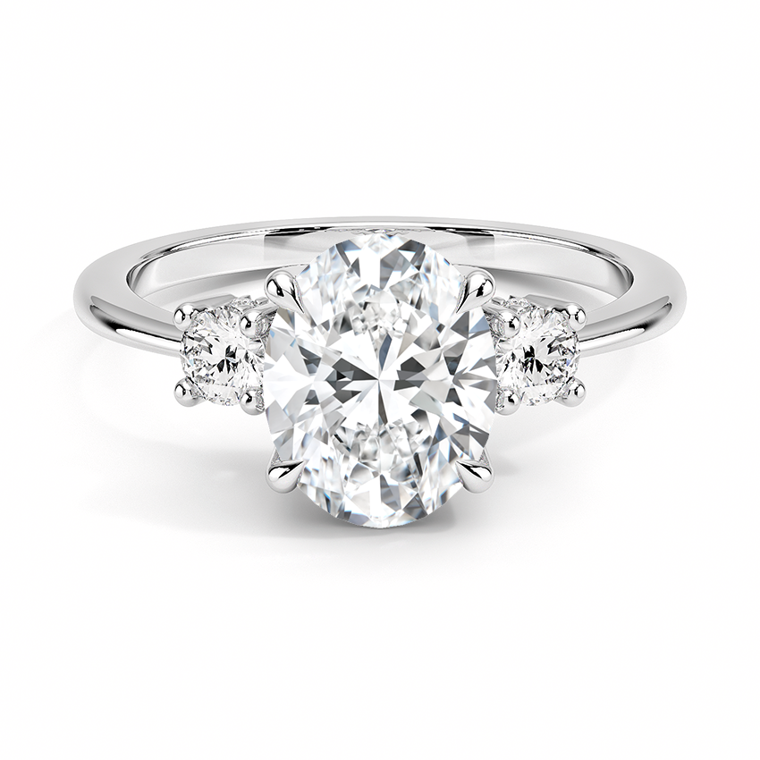 Anillo Encuentro con diamante oval y dos piedras laterales